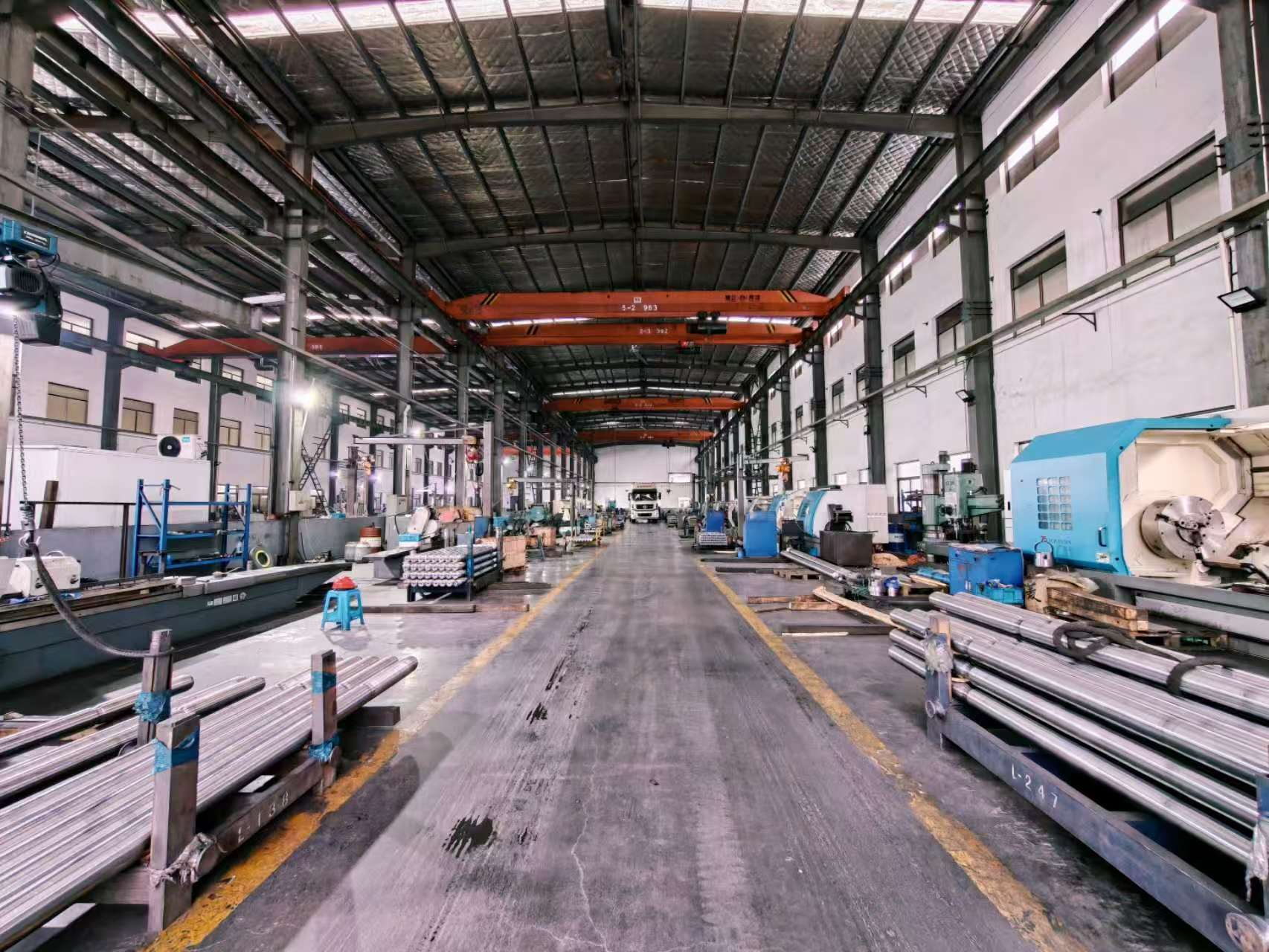RJ machining workshop with machine tools along a central aisle